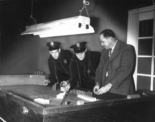 Game table seized in gaming raid — Calisphere
