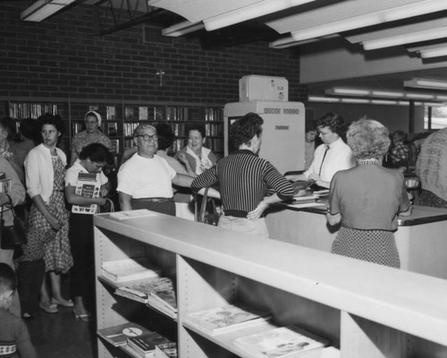 Checking out books at Panorama City Branch