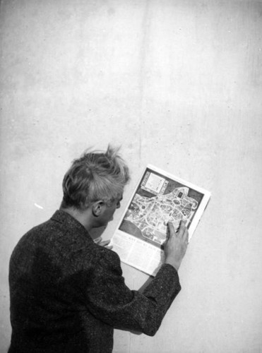 Herman Schultheis reads a map