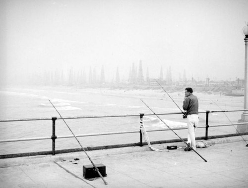 Fishing poles and oil fields, Huntington Beach