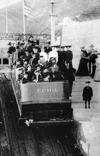 Group poses on Echo Incline car