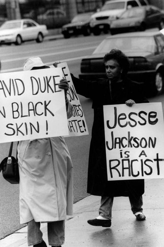 Women carrying protest signs