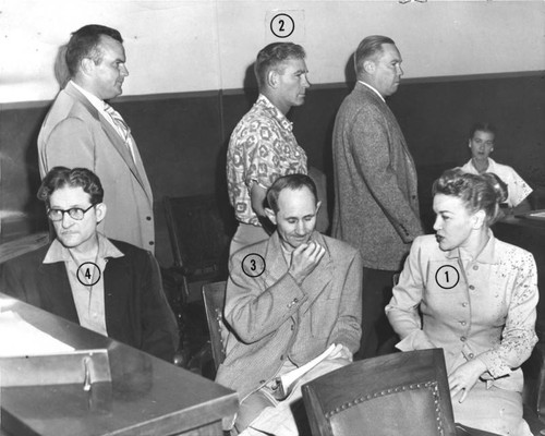 John L. True walks into courtroom