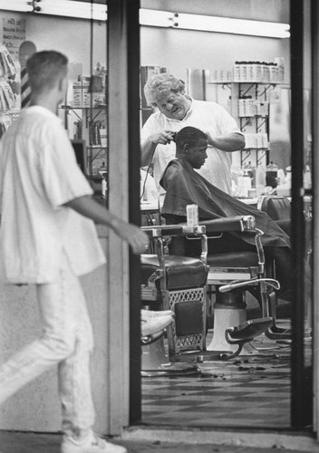 Barber giving a trim in Oceanside