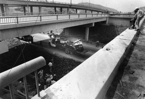 Van rolls off freeway