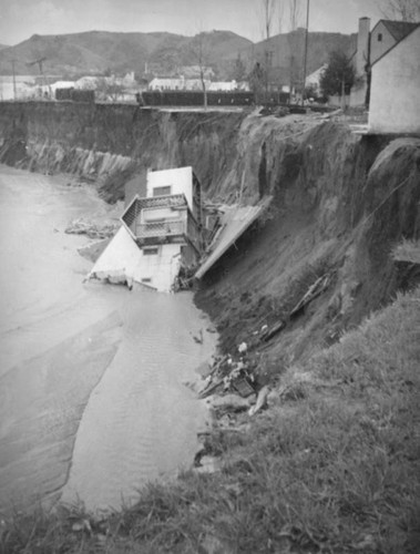 L.A. River flooding, house at the top and bottom of the river in North Hollywood