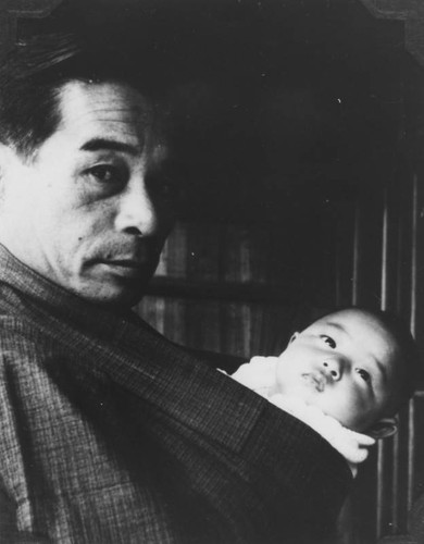 Man with a newborn baby