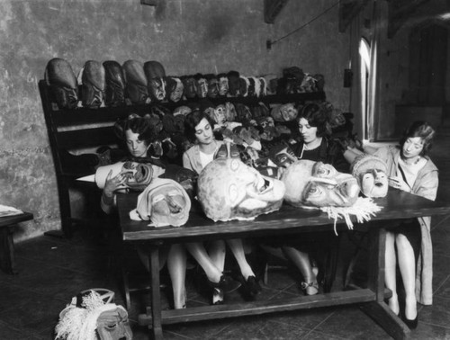 Women making costume masks