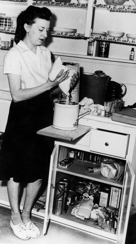 Mother in her kitchen, Ramona Gardens