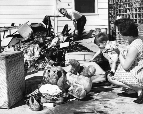 Nestors look over charred remains of home after fire