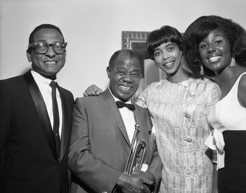 Louis Armstrong is presented with a resolution