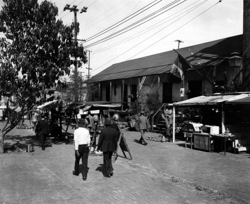 Avila Adobe, Olvera Street marketplace, and pedestrians