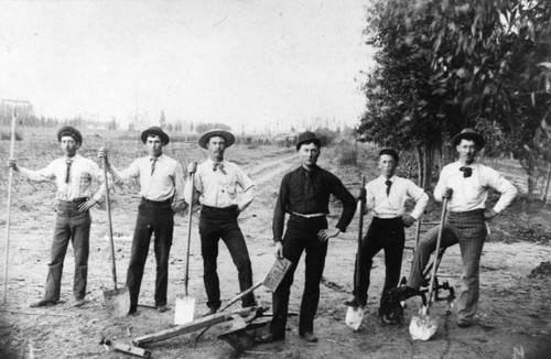 Men with shovels and plow