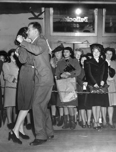 Dancing while waiting to shop