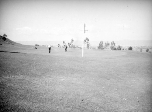 Playing golf at the Sunset Field Golf Club, Baldwin Hills