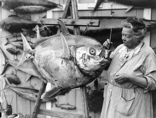 Woman preserves fish