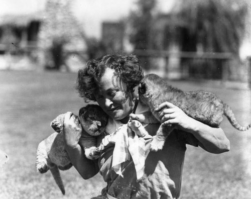 Mrs. Gay with baby lions