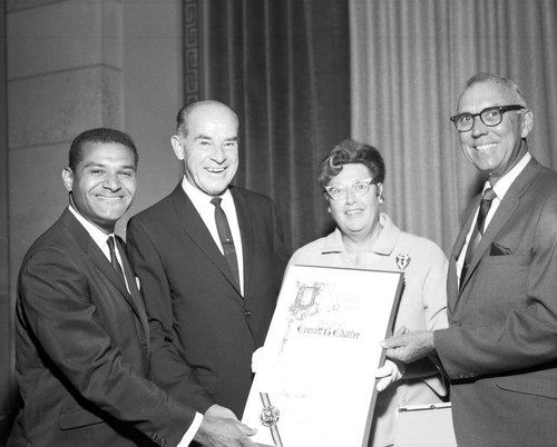 Billy Mills presents resolution to Dr. Everett B. Chaffee