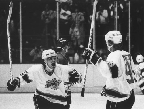 Luc Robitaille greets Wayne Gretzky