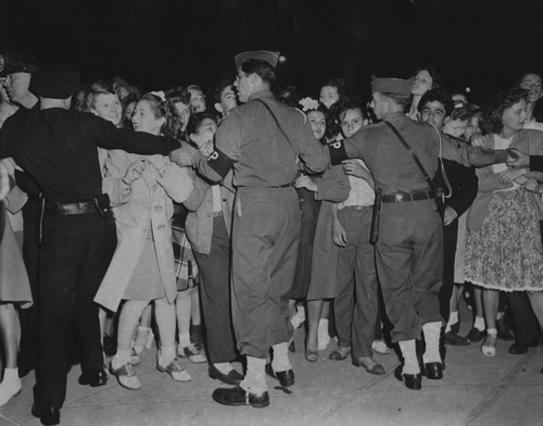 Police hold back crowds at Shirley Temple's wedding