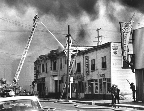 Building in fire during Watts Riots — Calisphere