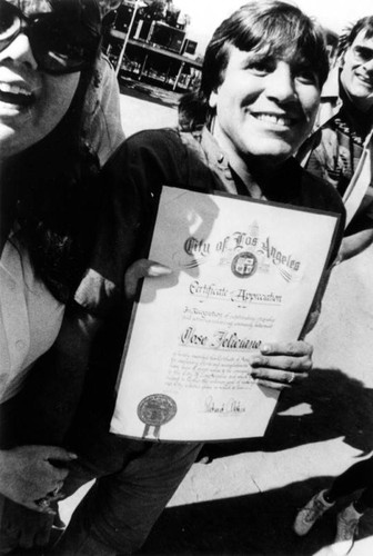 Jose Feliciano with certificate