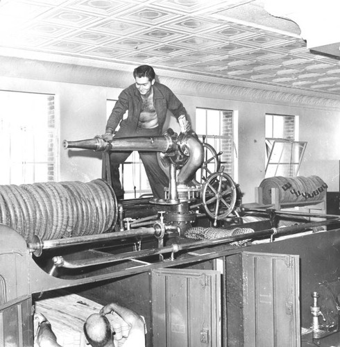 Polishing the brass on the old water cannon