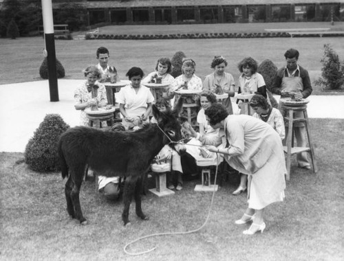 Students sculpting a donkey, view 2