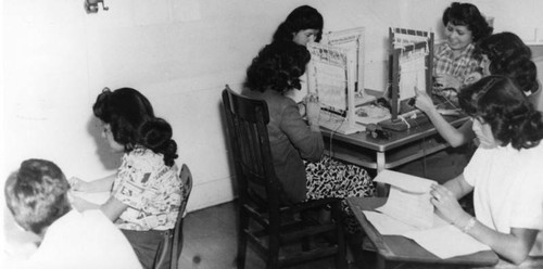 American Indian students in weaving class