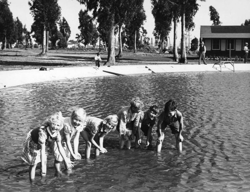 Recreation Park, children wading in the casting club pool