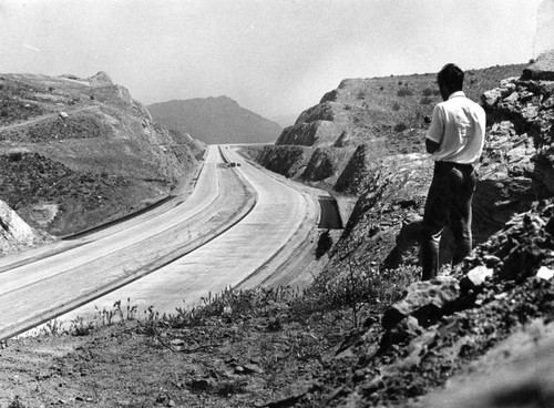 Workmen finish Antelope Valley freeway's first link in preparation for dedication today-16 miles connecting Los Angeles with the desert