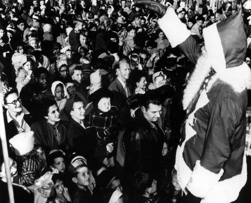 Santa waves "hi" to crowd