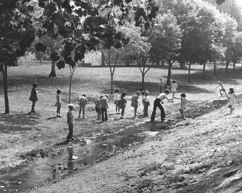 Hopping a stream in Griffith Park