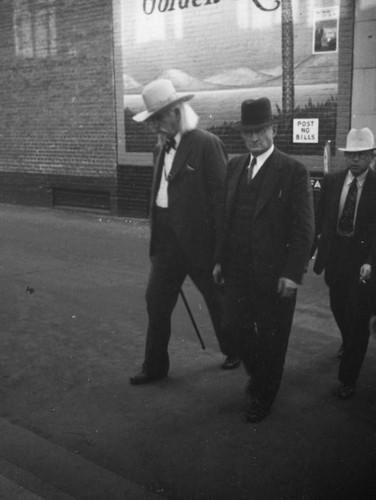 Cowboy walking with friends