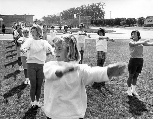 Cheerleaders learn new tricks