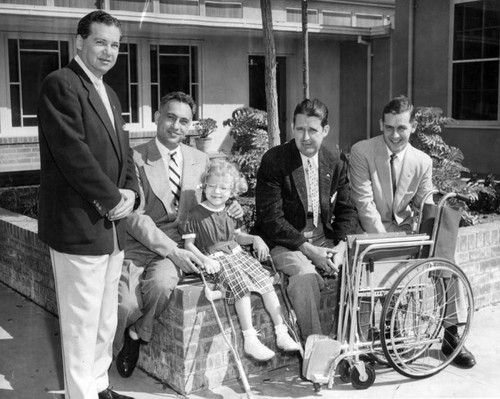 Rotarians present chair to school