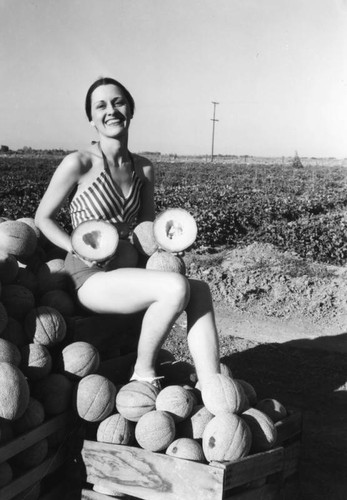 Woman with cantaloupes