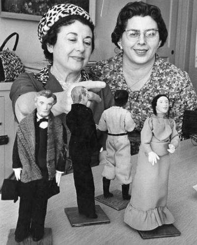 Mrs. Pike, left, shows 'Democracy Dolls