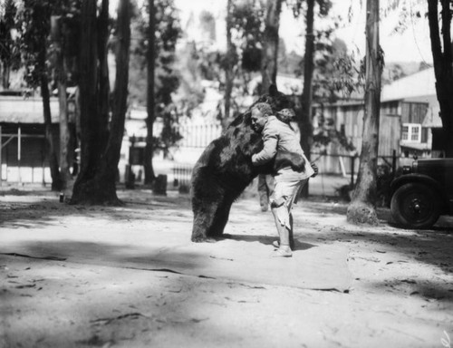 Man hugging bear