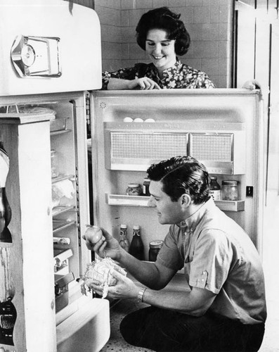 Wife, Pat, helps Pierre with salad