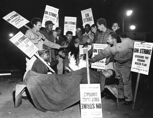 North American strikers try to keep warm