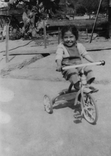 Girl on tricycle