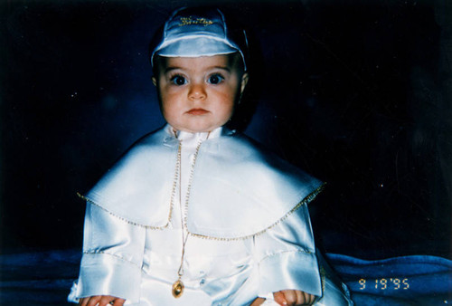 Baby in baptismal gown