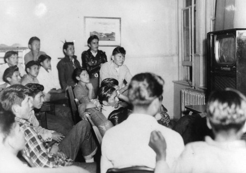 Navajo boys watching television