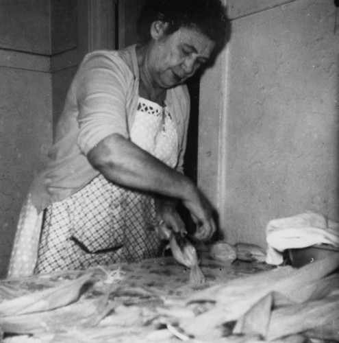 Woman making tamales