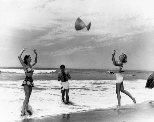 Women playing in the sand at Malibu