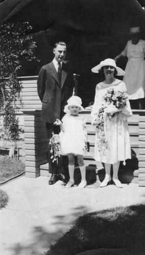 Bride and groom with flowergirl