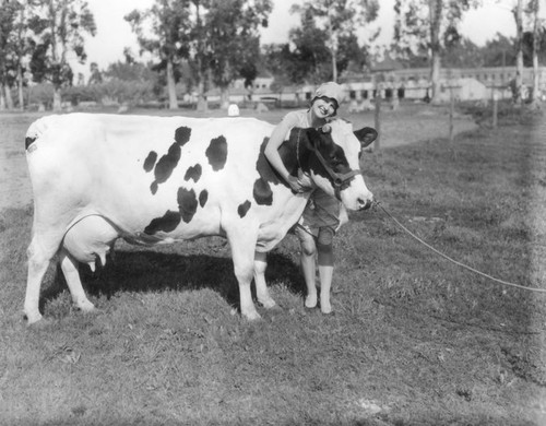 Woman hugging cow