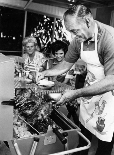 Will Massey adds seasoning to barbecued spareribs