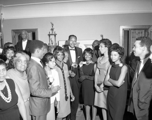 Councilmember Tom Bradley with a group of unidentified people